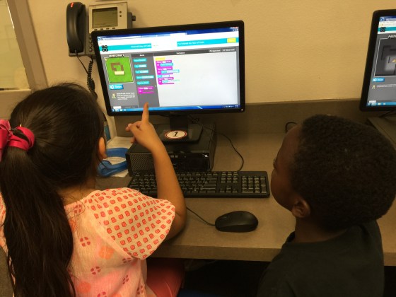 Dalia and Malachi explore coding together.