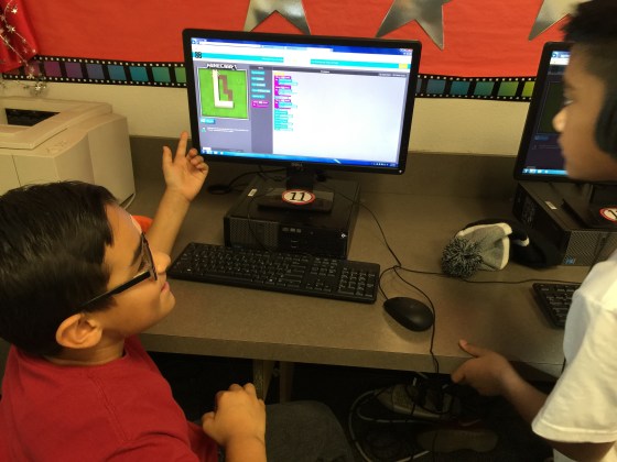Matthew G & Jaythan work together on a bit of Minecraft coding.